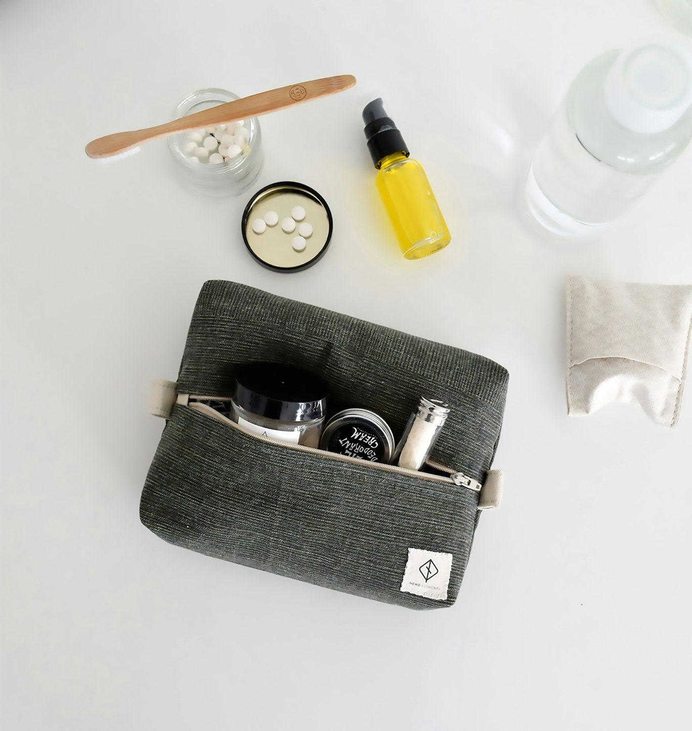 Travel-sized skincare samples packed in a clear toiletry bag