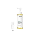 10ml sample bottle next to the full-size Anua Heartleaf Pore Control Cleansing Oil 200ml bottle
