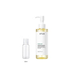 30ml sample bottle next to the full-size Anua Heartleaf Pore Control Cleansing Oil 200ml bottle